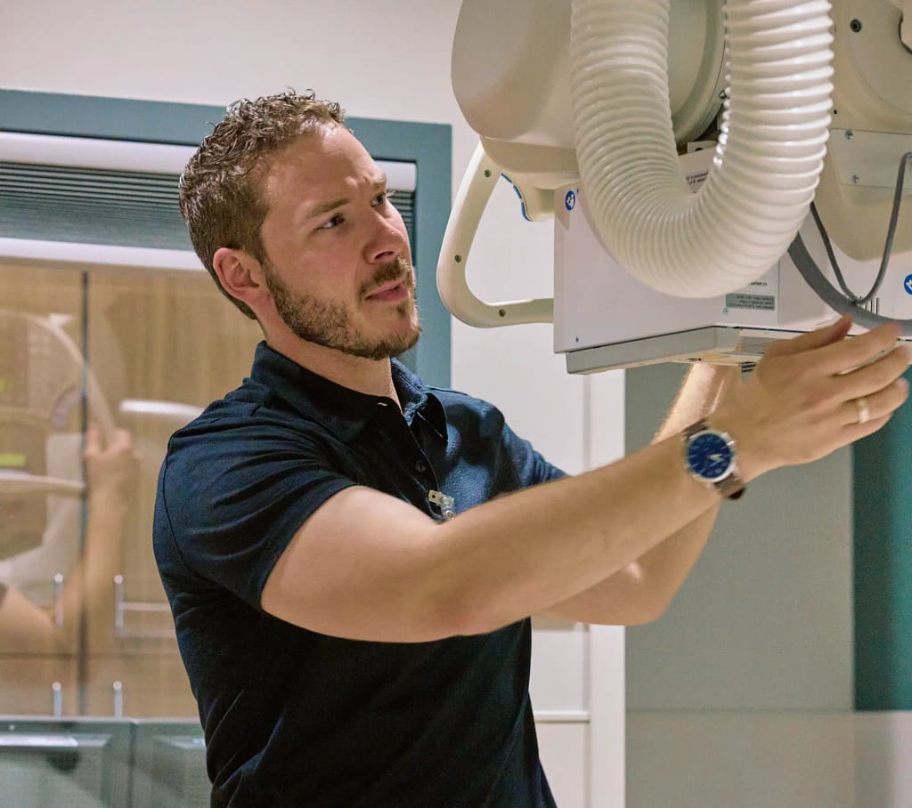 Adam working with X-ray machine