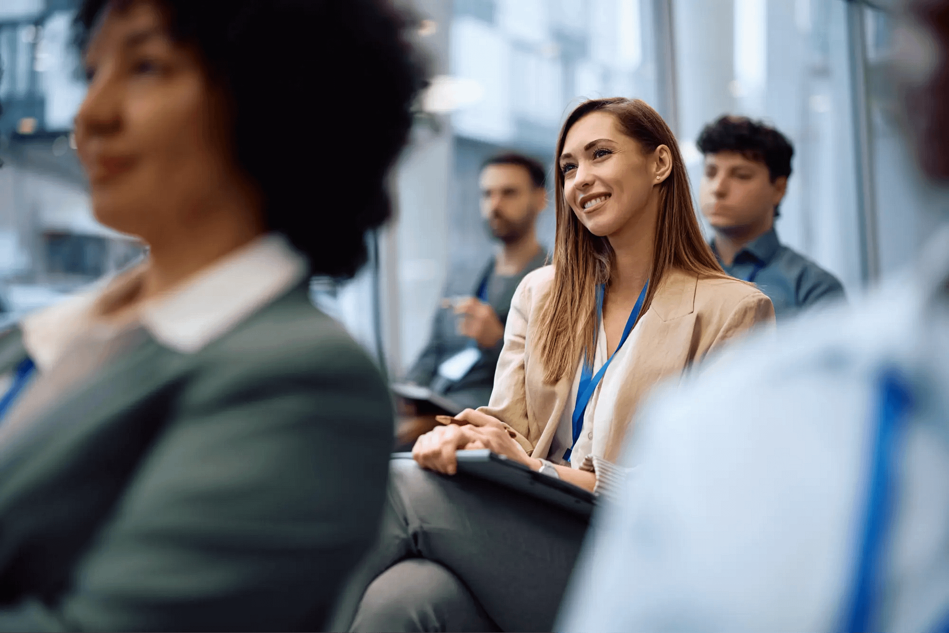 Woman in a seminar with notepad and pen