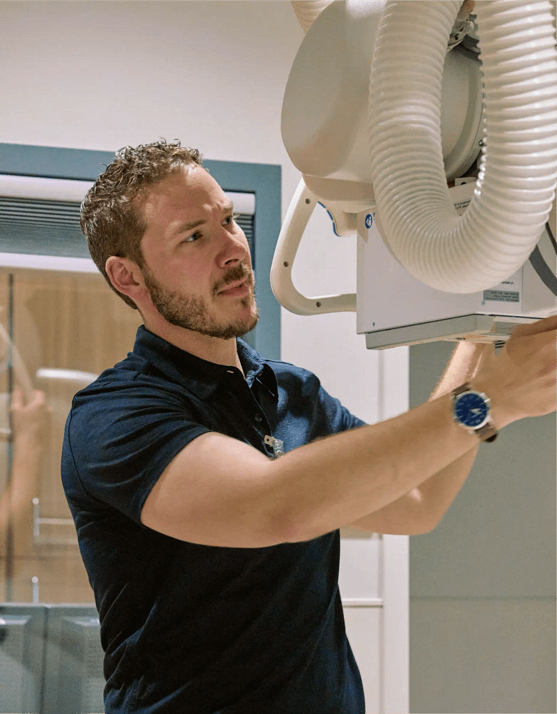 Adam working on X-ray machine